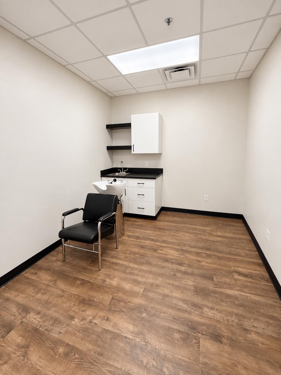Interior suite with shampoo basin, chair and storage